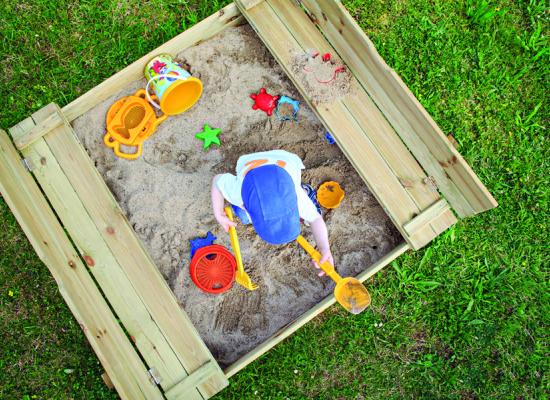 child playing in a sand box
